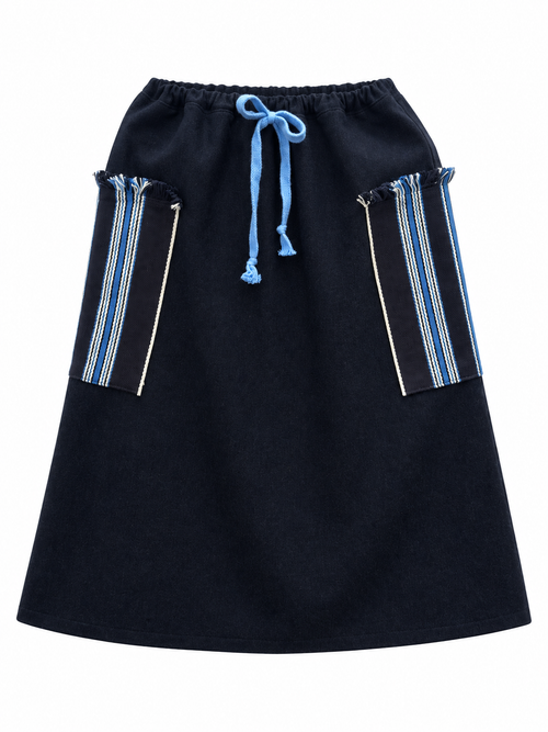 Dark wool skirt with blue tie and blue-and-cream striped woven side panels, front view