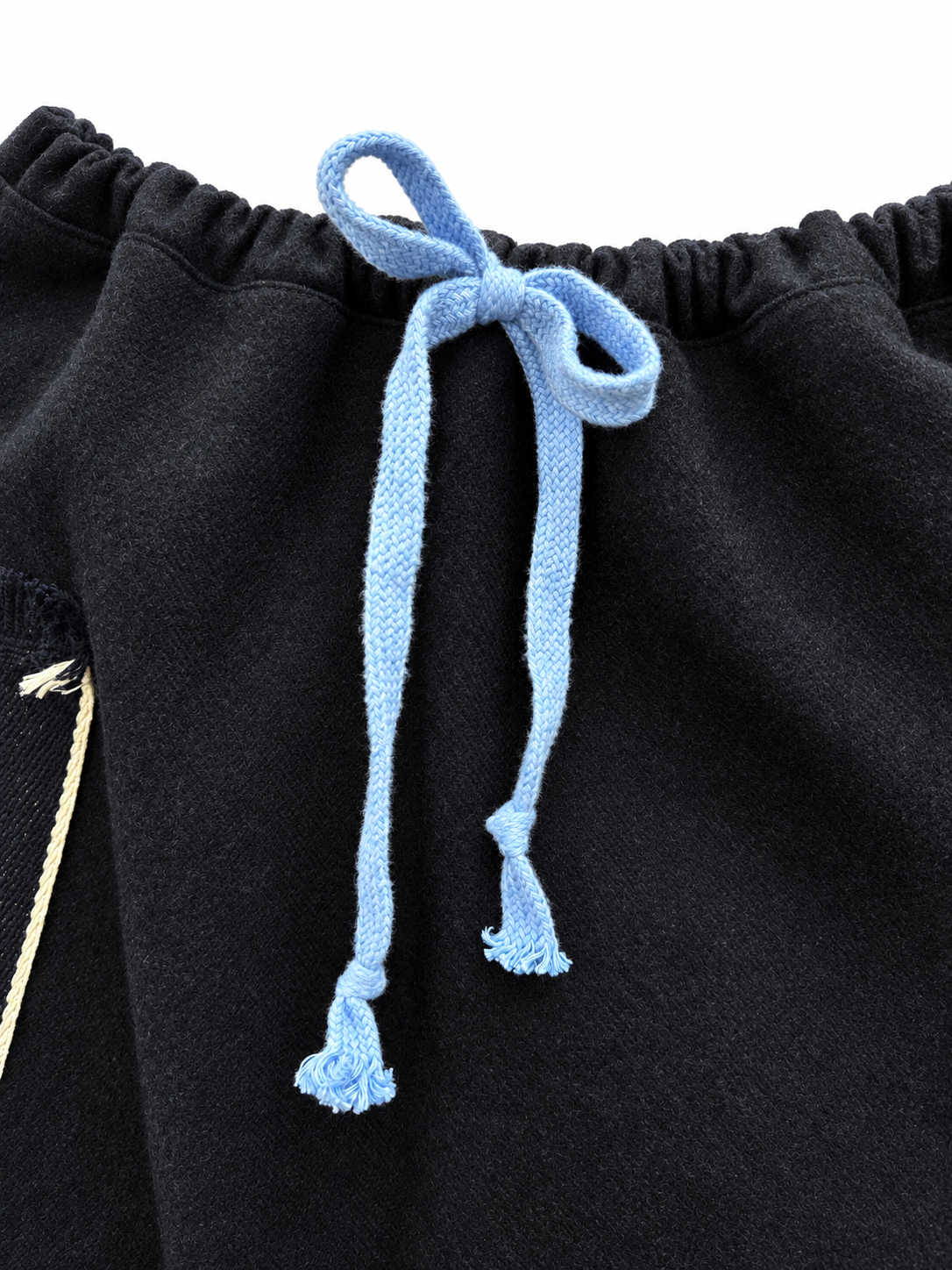 Sky-blue tie and gathered wool waistband