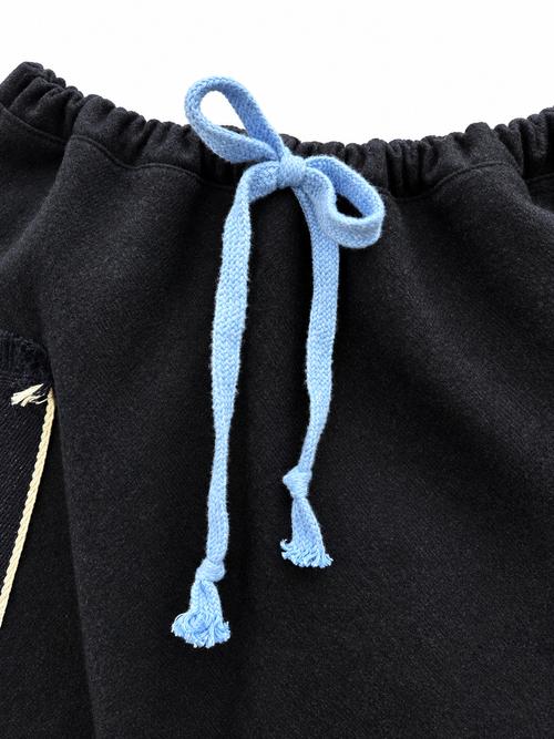 Sky-blue tie and gathered wool waistband