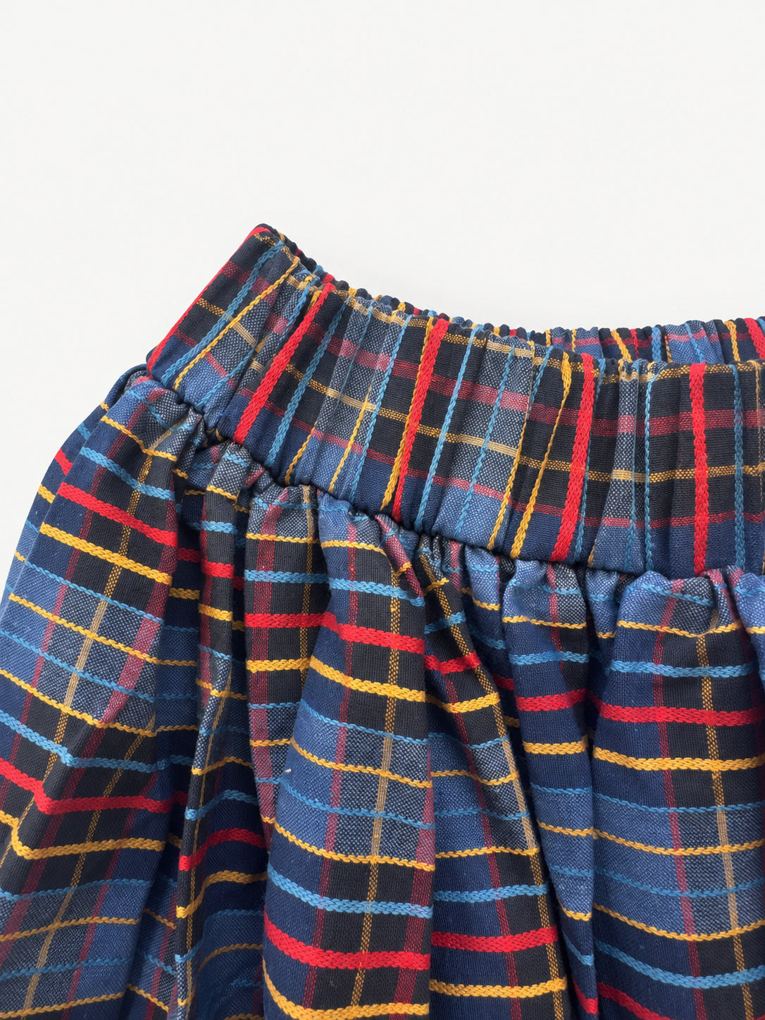 After School skirt — elastic waistband, checked fabric and patterned pocket details