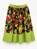 Black floral skirt with colourful flowers, a lime-green waistband and a wide lime-green hem