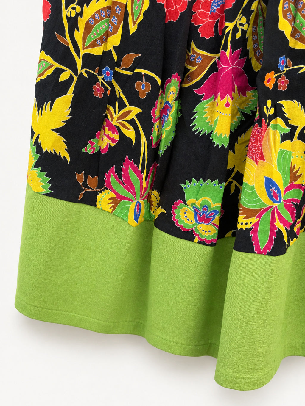 Black floral skirt with colourful flowers, a lime-green waistband and a wide lime-green hem