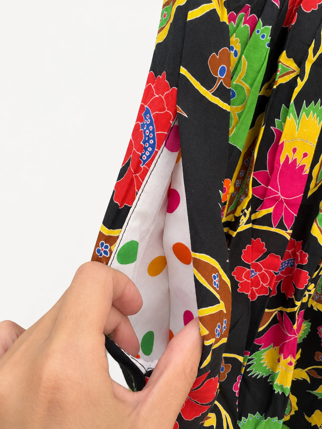 Black floral skirt with colourful flowers, a lime-green waistband and a wide lime-green hem