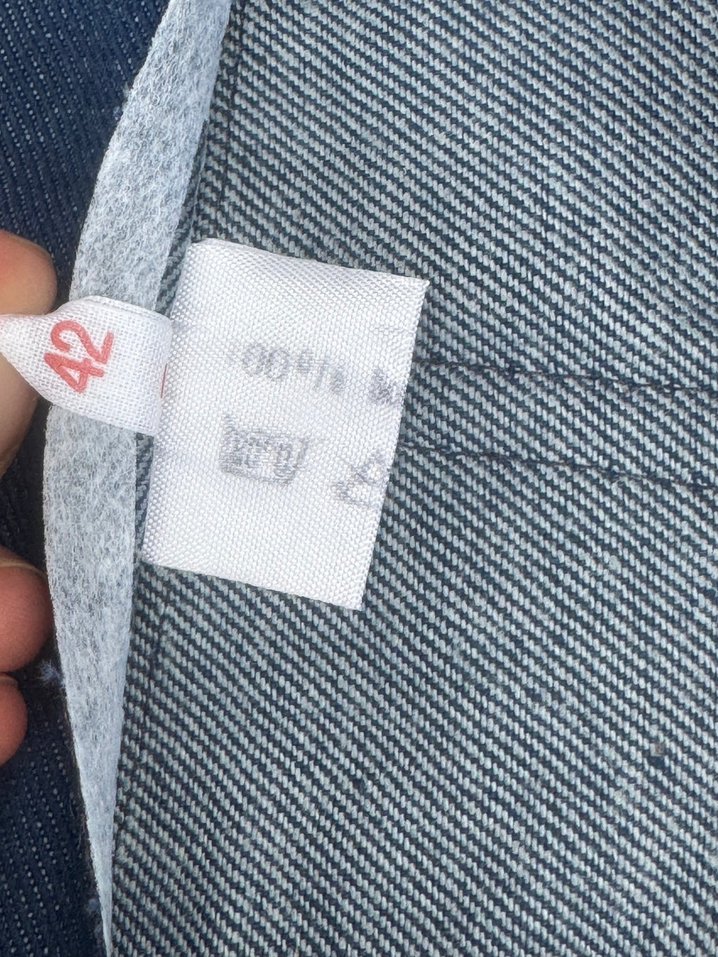 Original size 42 and faded garment label