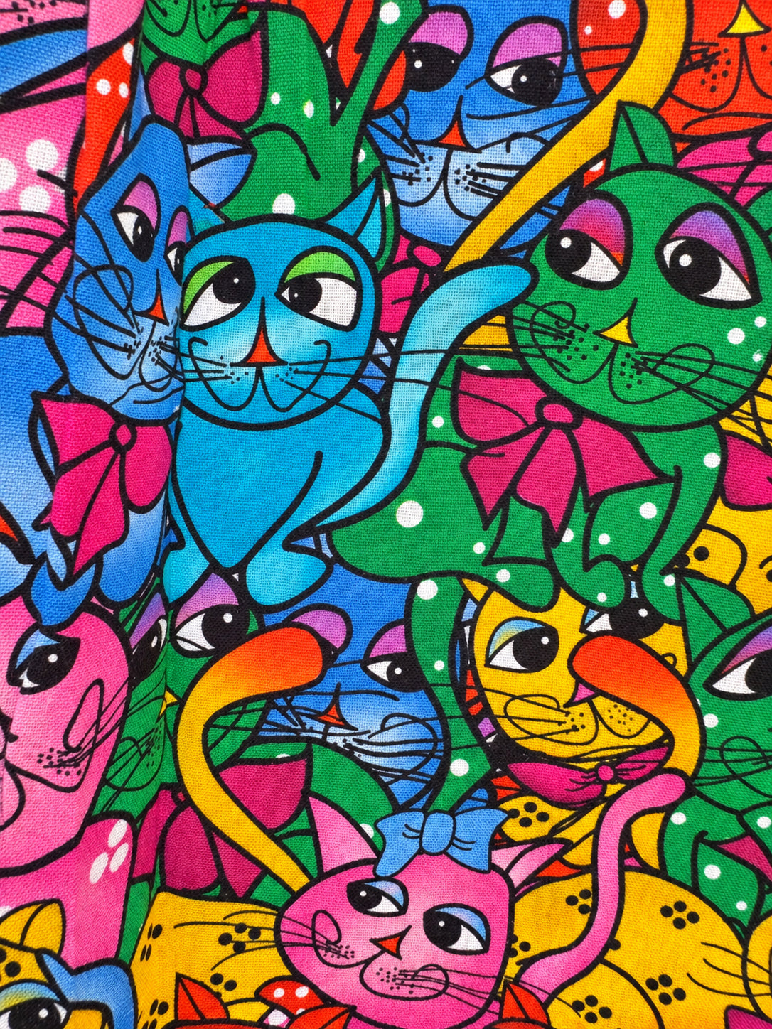 Colourful cat-print skirt with a turquoise waistband and wide turquoise hem