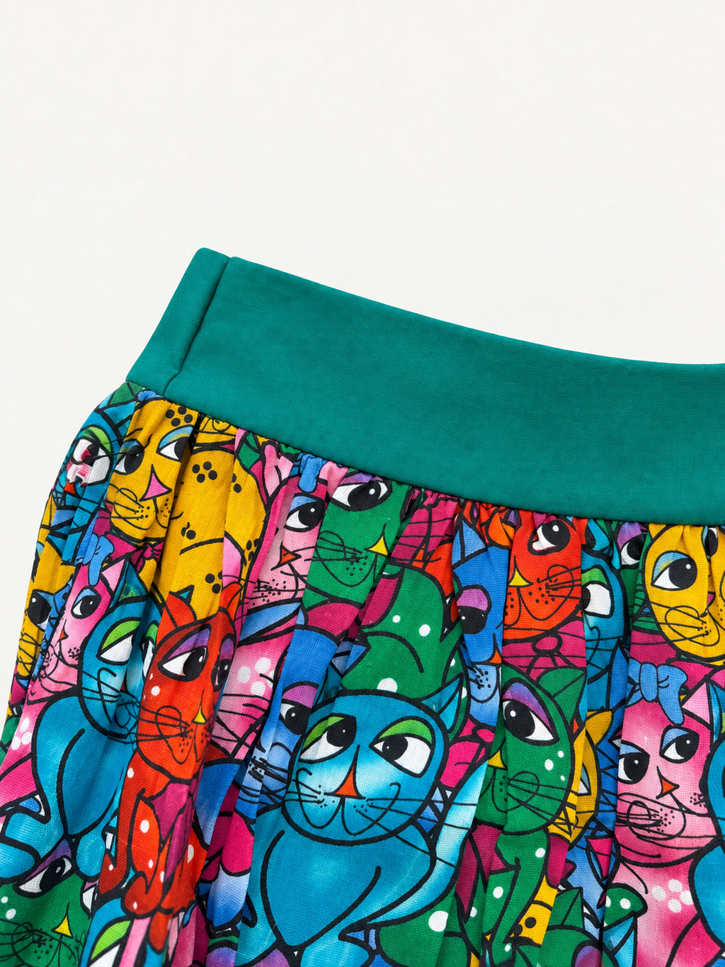 Colourful cat-print skirt with a turquoise waistband and wide turquoise hem