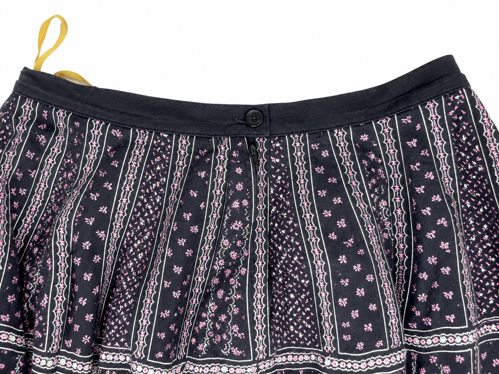 Cotton skirt waistband, button and zip detail on white background