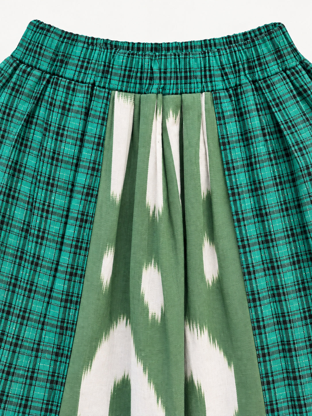 Green checked skirt with a green-and-cream ikat panel and pink rickrack trim
