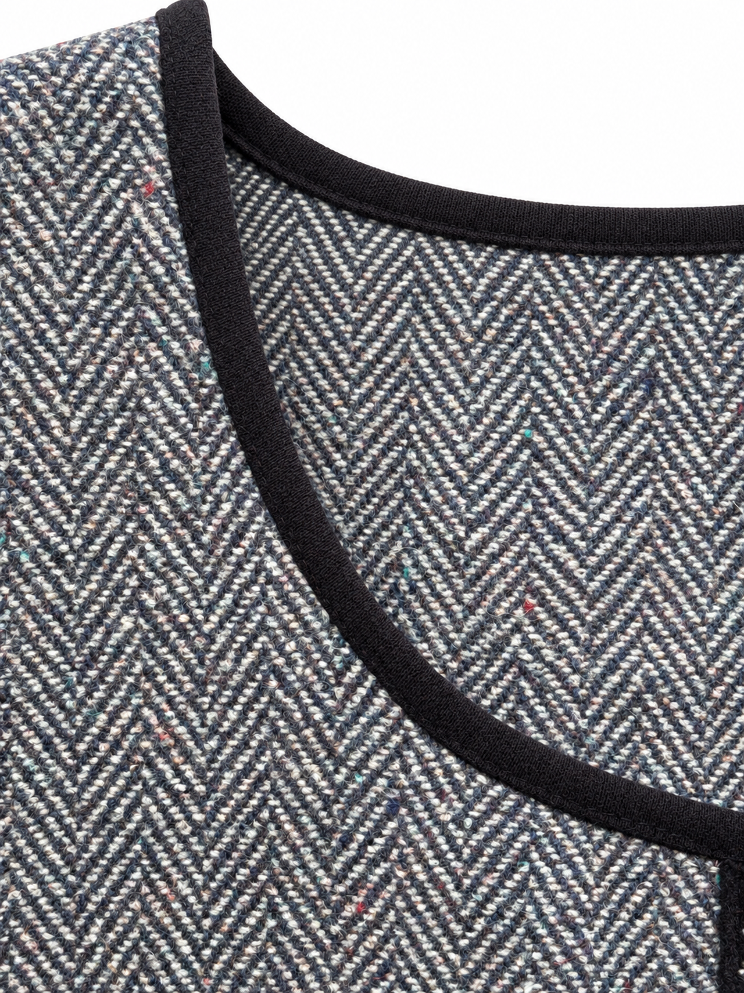 Black neckline binding and herringbone weave detail