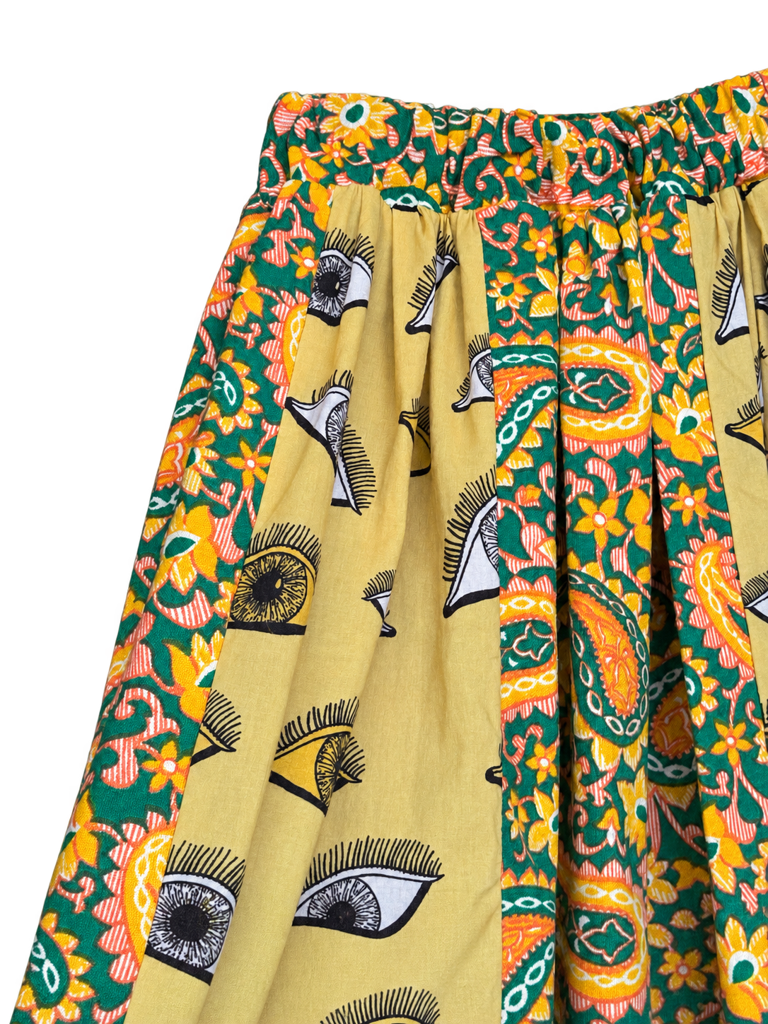 Green paisley and eye-print skirt — waist detail