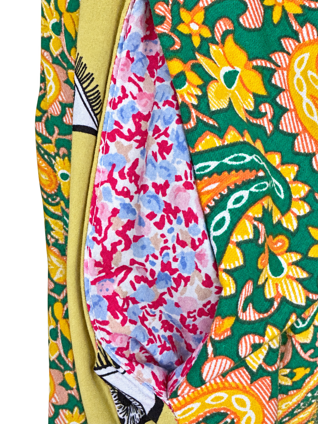 Green paisley and eye-print skirt — floral pocket lining