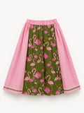 Pink skirt with an olive-green flamingo-print panel and decorative ribbon trim