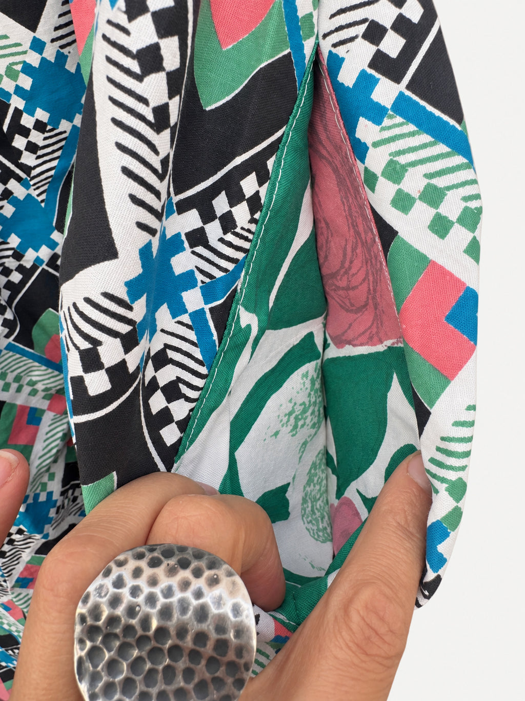 Geometric-print skirt with a raspberry-pink waistband and wide pink linen hem