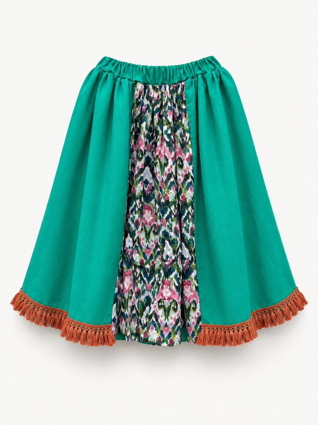 Bright green skirt with a multicoloured centre panel and orange tassel trim