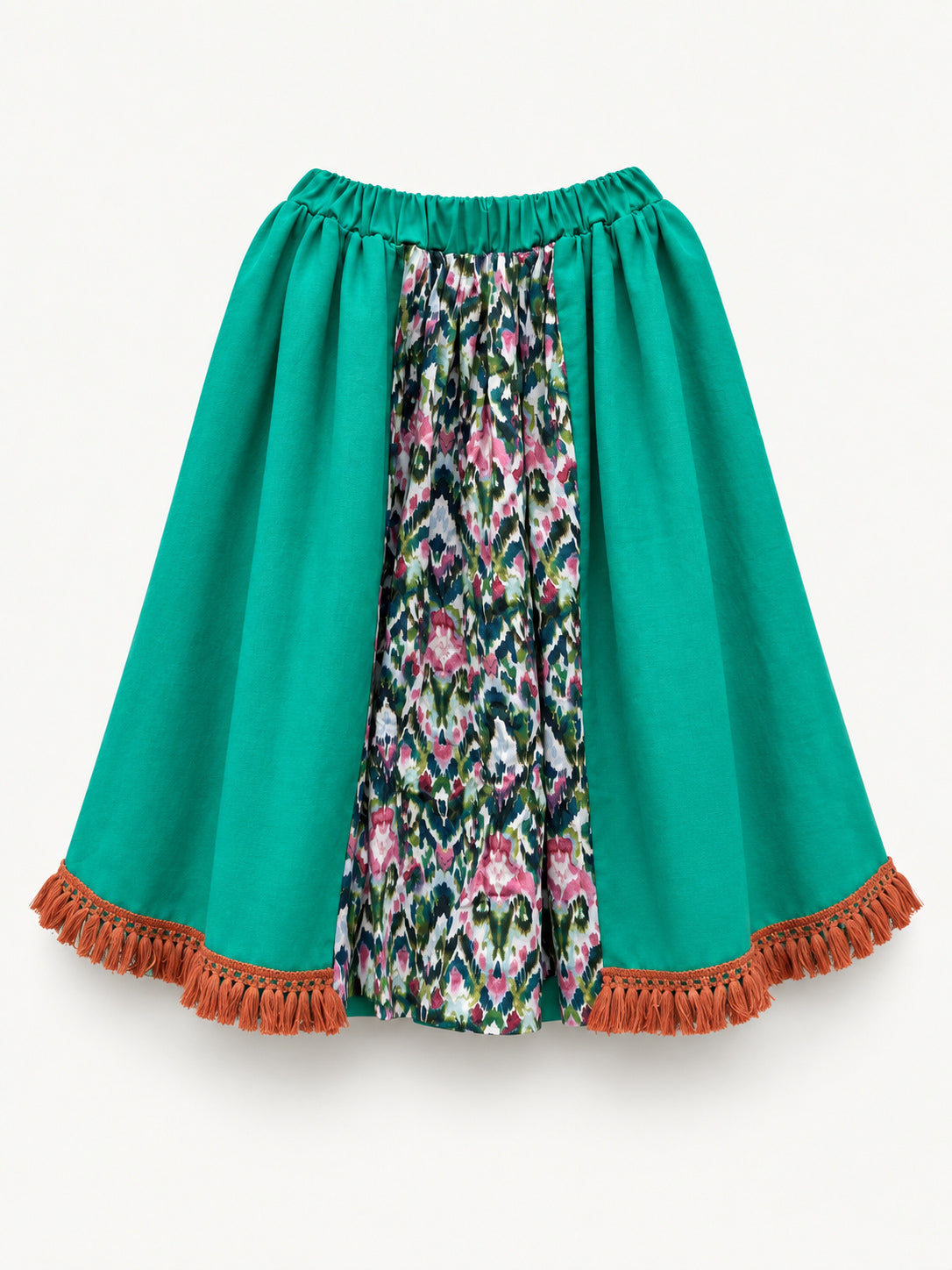 Bright green skirt with a multicoloured centre panel and orange tassel trim