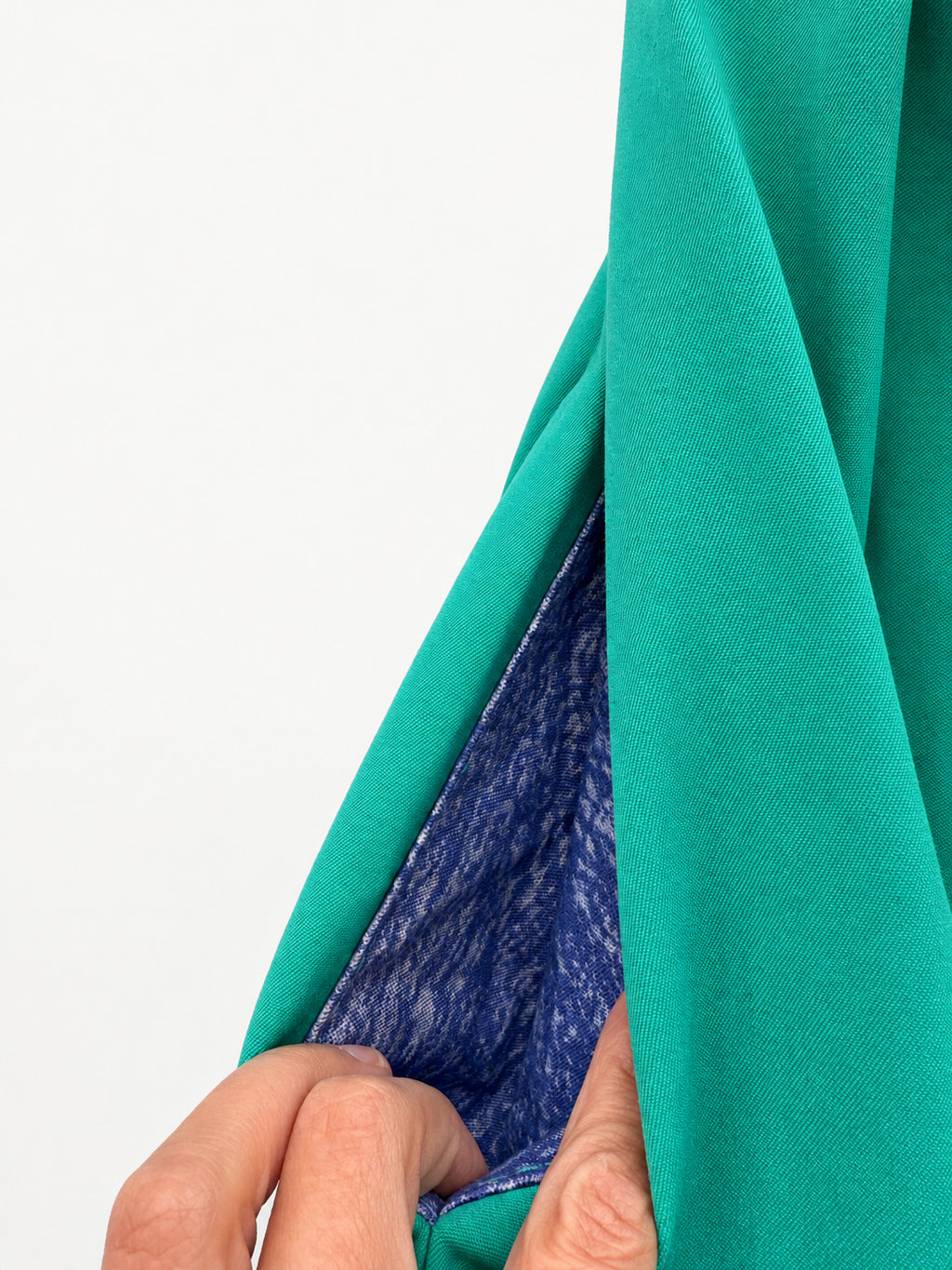 Bright green skirt with a multicoloured centre panel and orange tassel trim