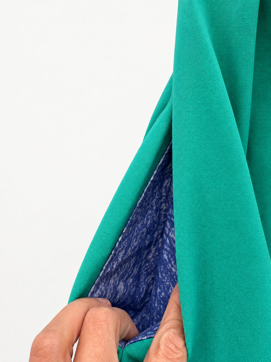 Bright green skirt with a multicoloured centre panel and orange tassel trim