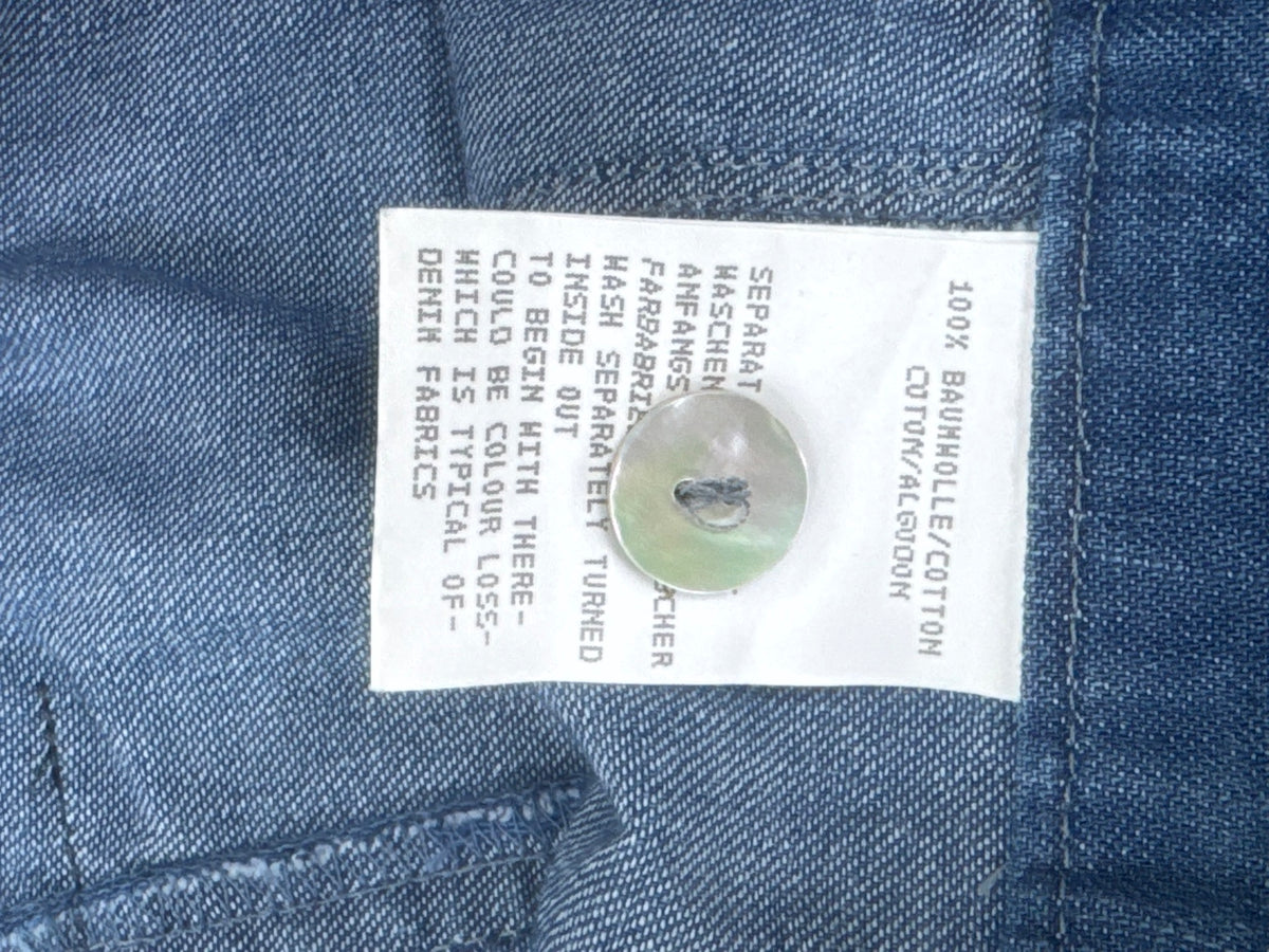 Original 100 percent cotton fabric label and spare button