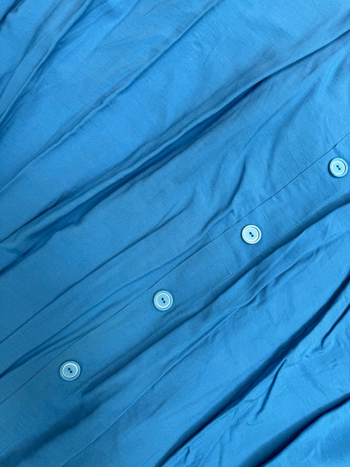 Original blue fabric and button detail
