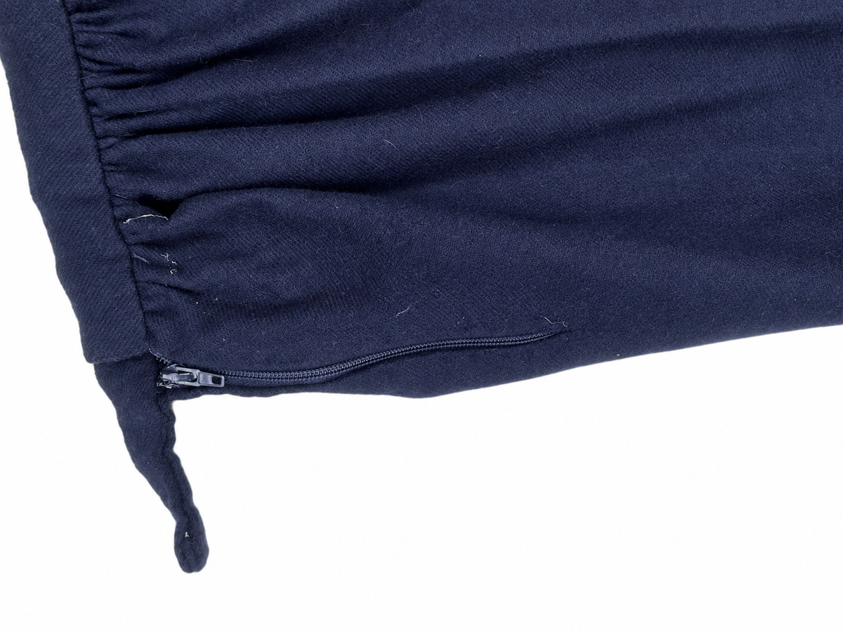 Waistband and side zipper detail on white