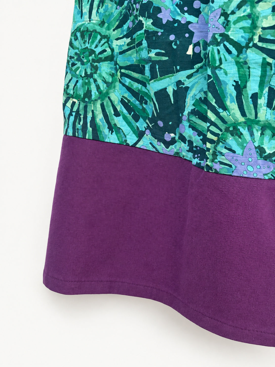 Teal patterned skirt with a purple waistband and wide purple hem