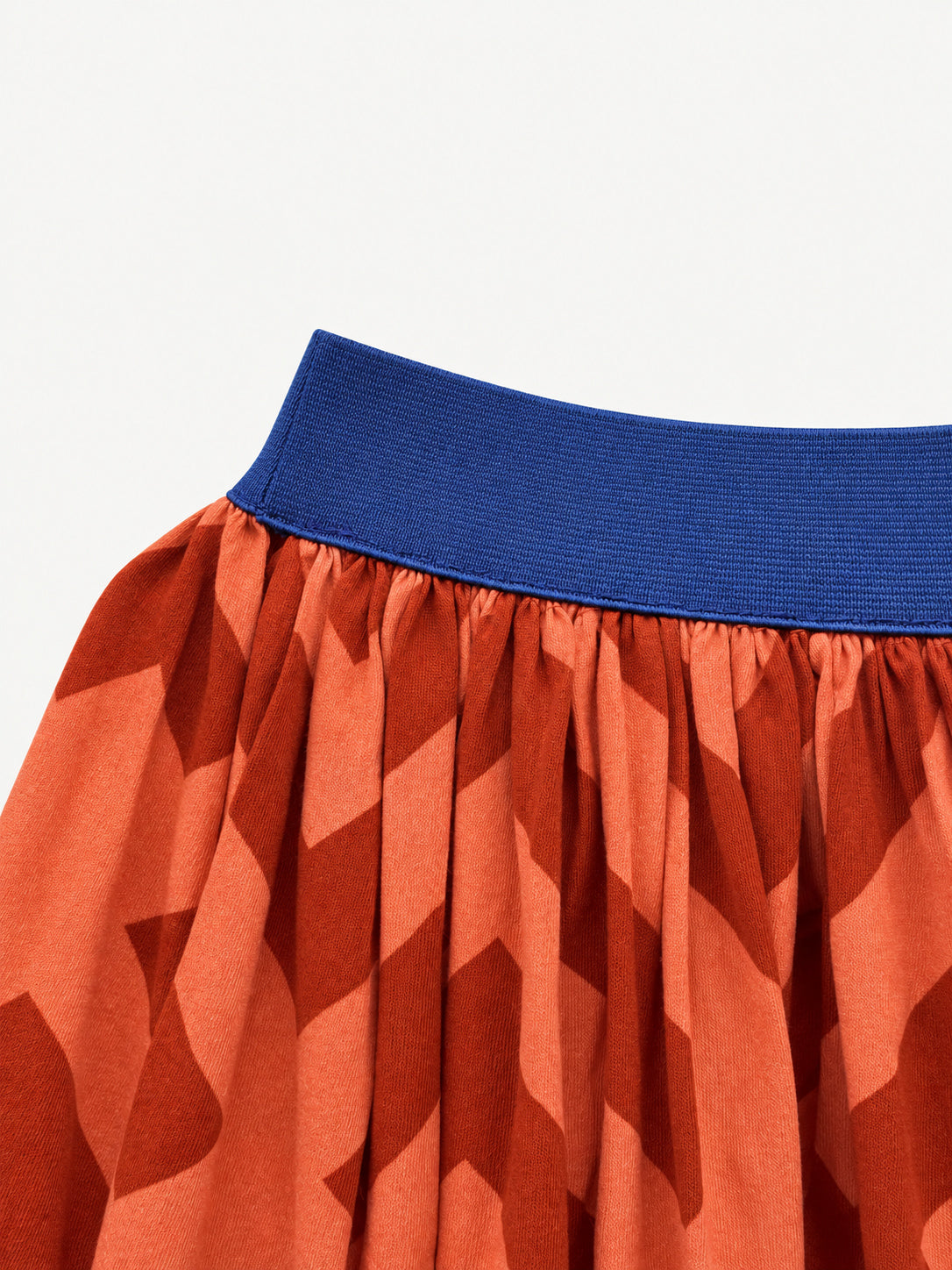 Orange geometric-print skirt with a navy-blue elastic waistband