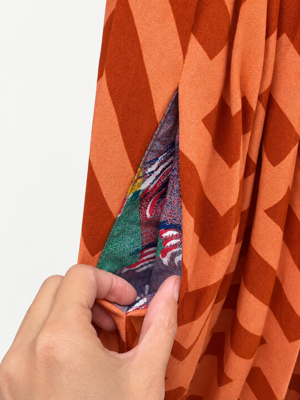 Orange geometric-print skirt with a navy-blue elastic waistband