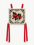 Vintage cream top with red rose needlework, black decorative border and red ribbon ties