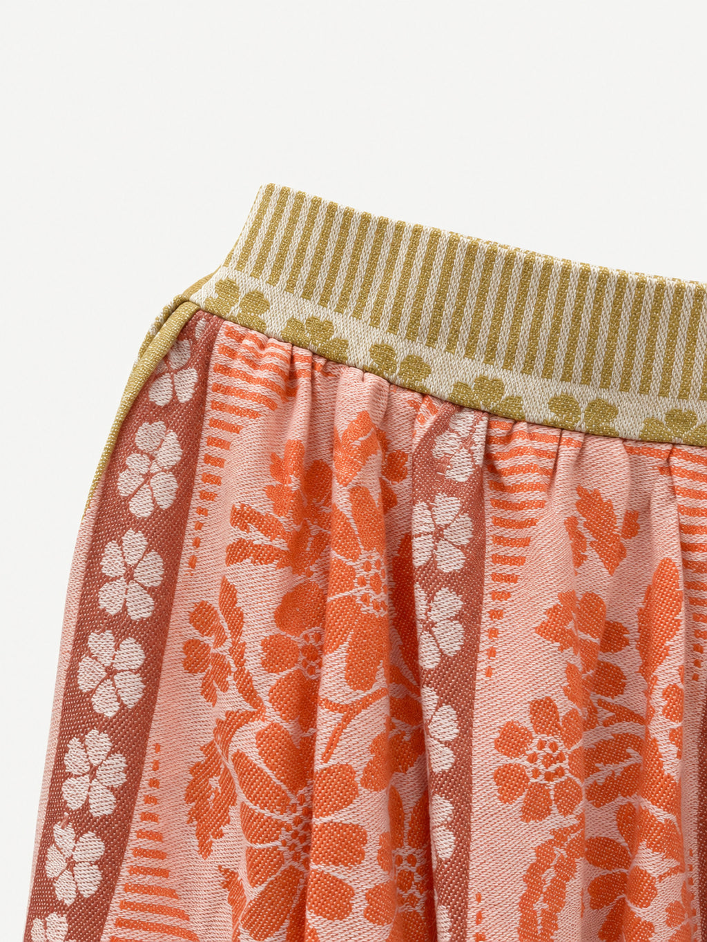 Detail of waistband and orange floral fabric