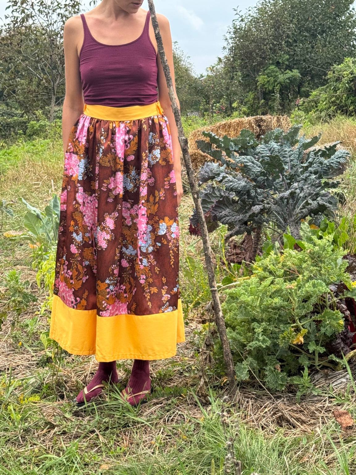 A Viva La Fusta skirt worn among the garden beds