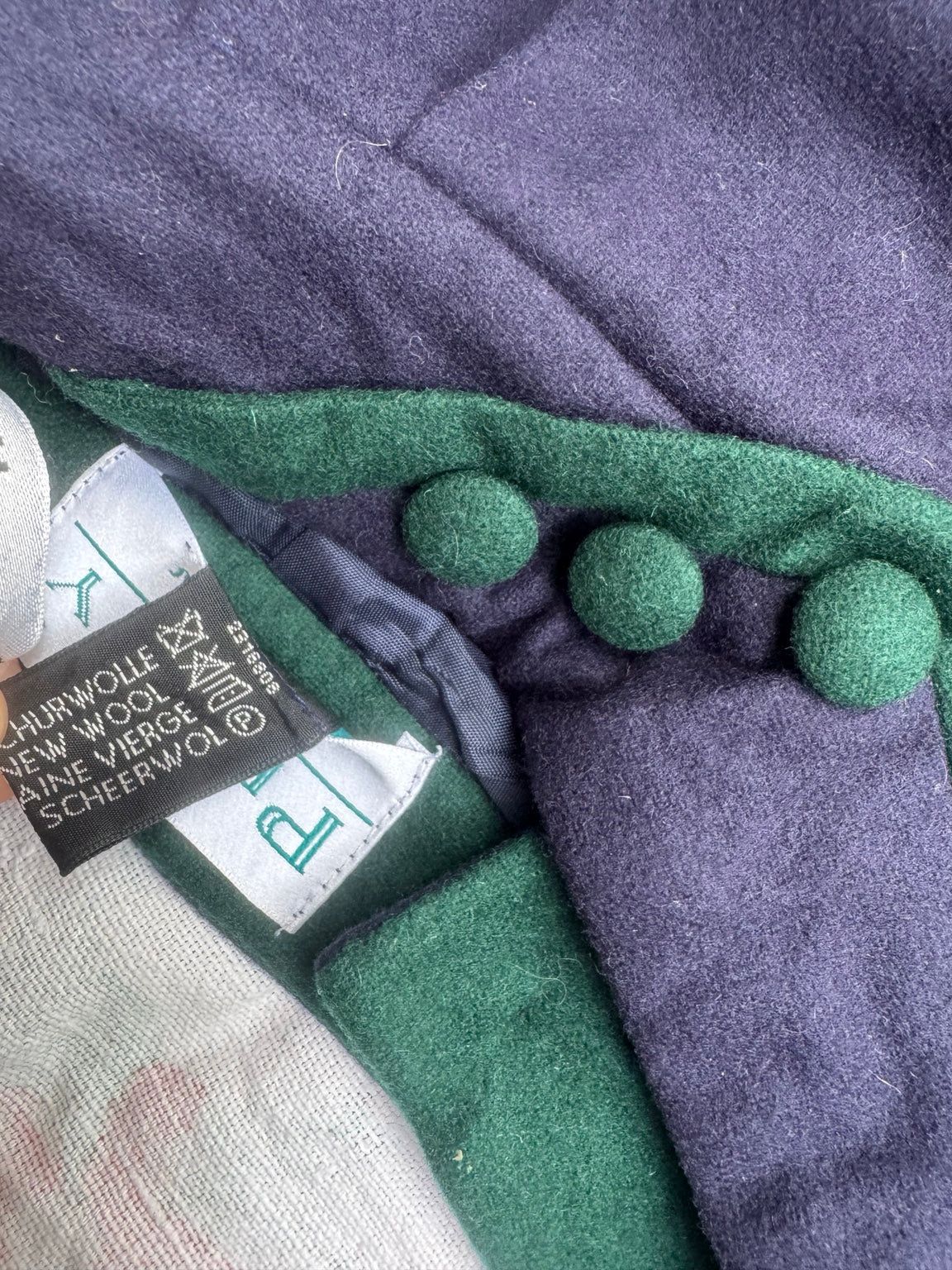 Original pure new wool label and green covered buttons