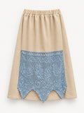 Full front view of cream winter skirt with pale-blue hand-crocheted curtain panel